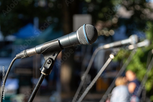 Microphone on stage outside in sunny weather
