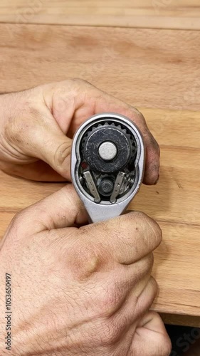 The ratchet mechanism demonstrates how the pawl engages with the ratchet wheel's teeth, allowing movement in one direction and preventing reverse motion. This video shows its inner workings