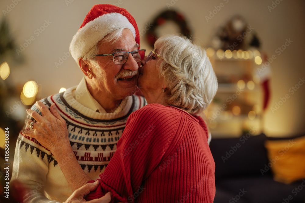 © bernardbodo - Grandma kissing her husband on a cheek on holidays © bernardbodo - Grandma kissing her husband on a cheek on holidays