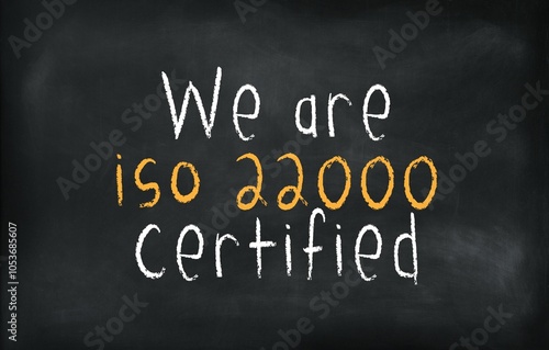 We are ISO 22000 certified written on a chalkboard background, emphasizing food safety management standards and commitment to quality assurance.