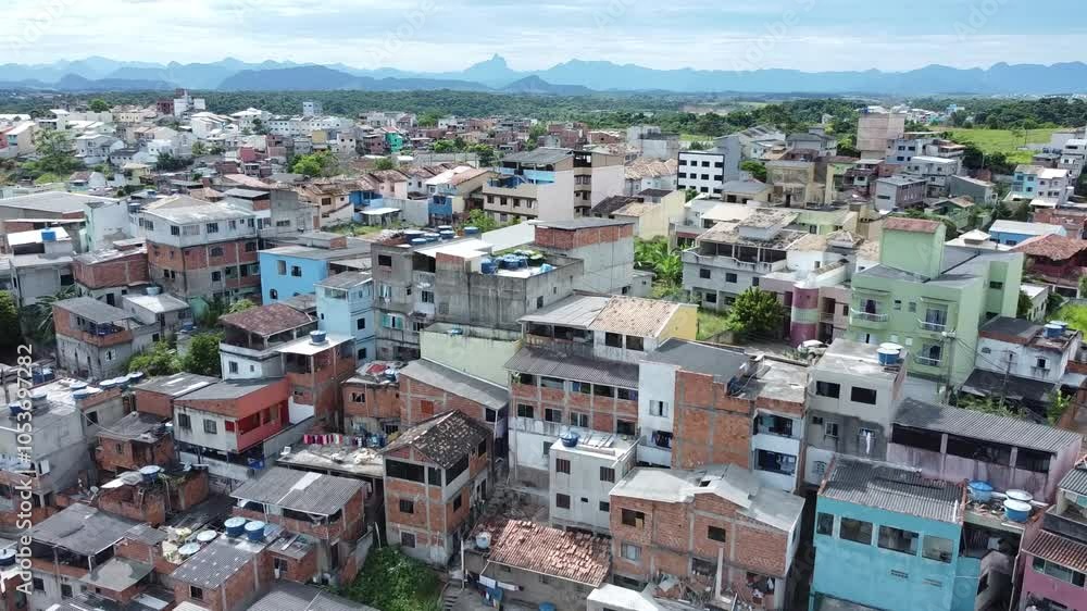 A drone shot of a favela in Rio de Janeiro captures the densely packed, colorful buildings sprawling across the hillside. A drone shot of a favela in Rio de Janeiro captures the densely packed, colorful buildings sprawling across the hillside.