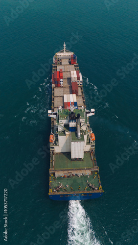 Logistics and container loading by large barges by sea in a harbor full of containers waiting to be transported.. photo