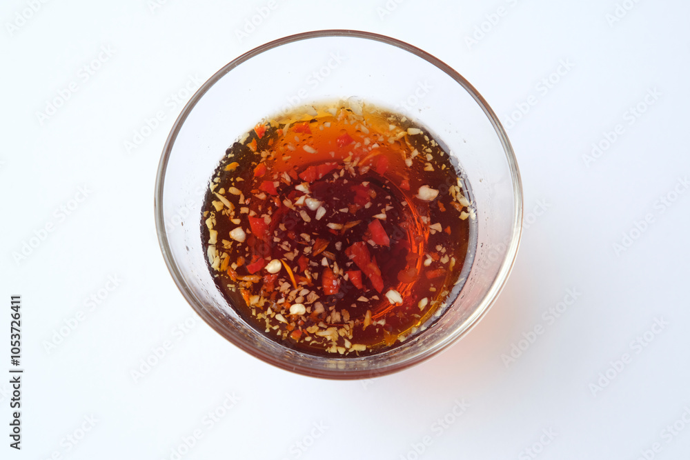 Sweet chili sauce served in a small dish bowl. Sweet chili sauce served in a small dish bowl.