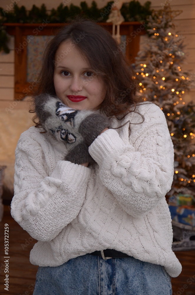 Girl near the Christmas tree on New Year's holidays Girl near the Christmas tree on New Year's holidays
