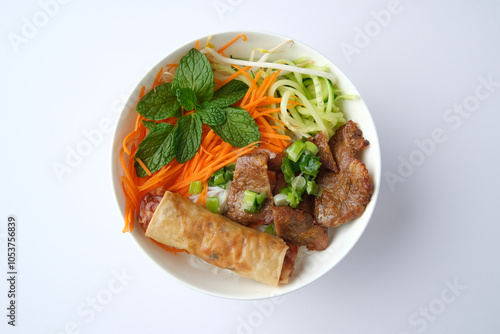 Beef noodle salad topped with fried lumpia