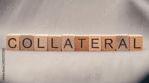 Collateral financial security and business liability concept displayed with wooden blocks spelling out the word  collateral   Representing contracts loans debt assets and other financial obligations