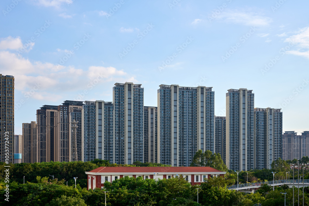 Fototapeta premium High-Rise Apartments with Blue Sky Background 