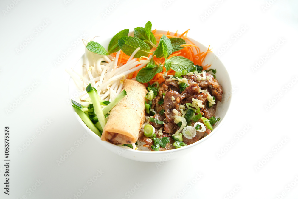 Bun Cha Gio bowl with meat slices topped with fried spring roll. Bun Cha Gio bowl with meat slices topped with fried spring roll.