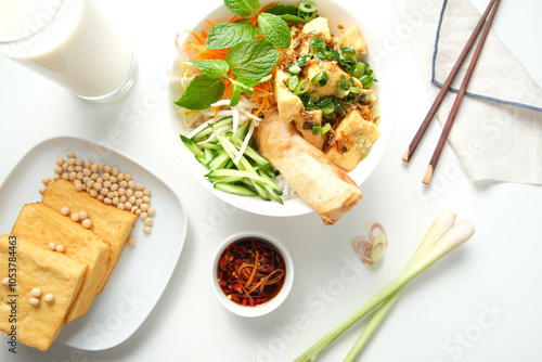 Tofu Bun Cha Gio bowl topped with fried spring roll. photo