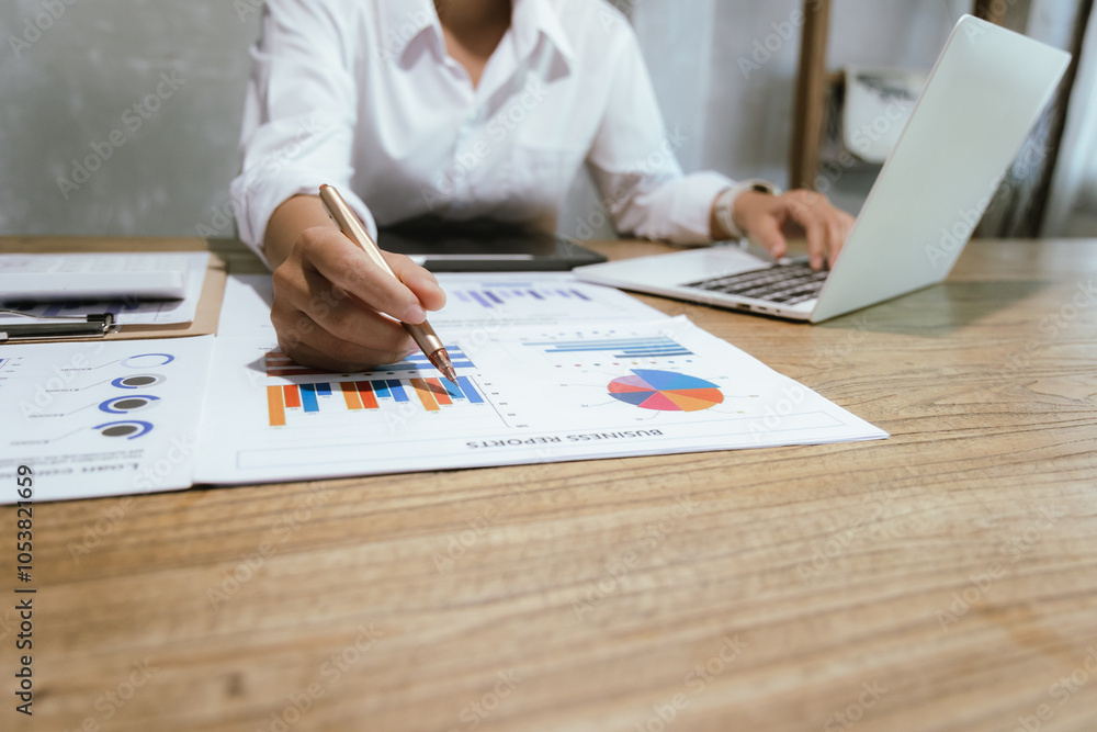 Businessman or accountant is analyzing data charts, graphs and dashboards on laptop screen to prepare statistical report. Businessman or accountant is analyzing data charts, graphs and dashboards on laptop screen to prepare statistical report.