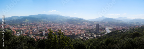 wide skyline panorama of Bilbao, spain with blue sky, from mount artxanda