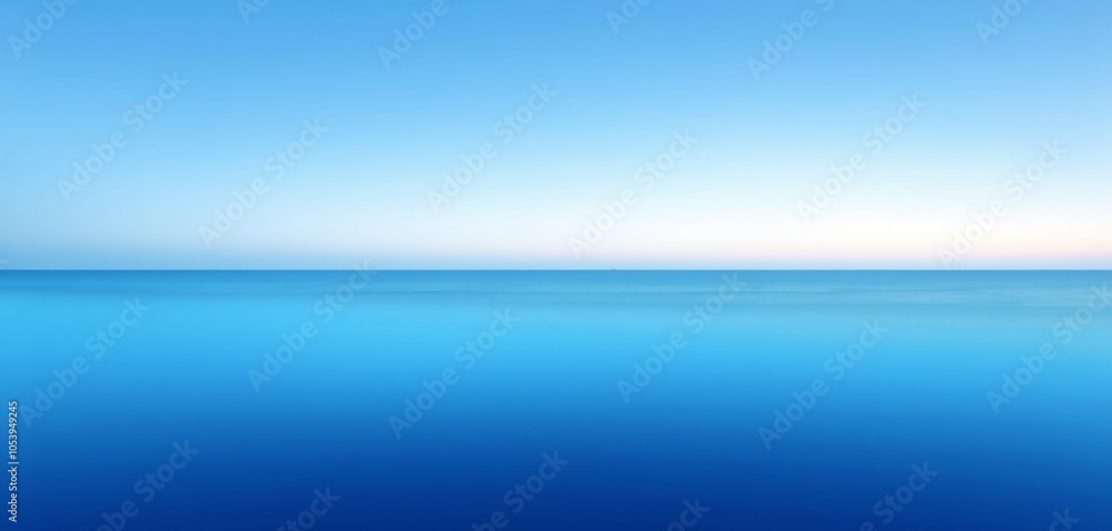 Obraz premium Beautiful sunset over the ocean with gentle waves and warm glowing colors