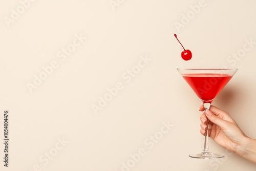 Retro 1960s and 1970s woman holding a cocktail on a plain background photo