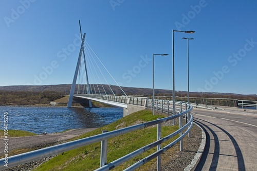 View of modern Tana bridge in clear summer weather, Tana Bru, Norway. photo