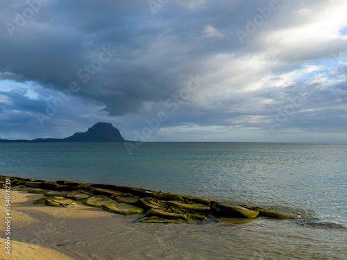 Spectacular clouds over Le Morne Brabant as seen from La Preneuse beach in Mauritius photo