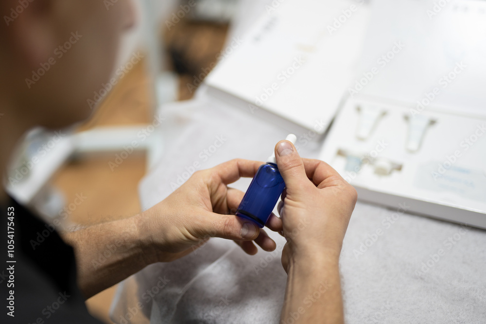 Obraz premium man doctor, cosmetologist holds drugs in his hands