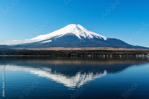 Mt. Fuji with reflection at Yamanaka lake, Yamanashi, Japan photo