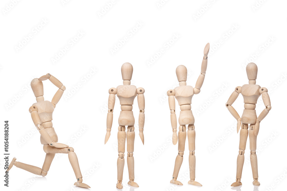 Wooden Art Mannequins in Various Poses on White Background Wooden Art Mannequins in Various Poses on White Background
