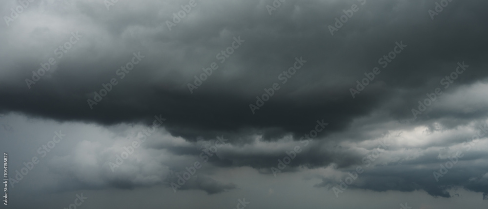 Fototapeta premium Overcast sky with dark clouds. Dark sky before a thunder-storm. The gray cloud background before rain.
