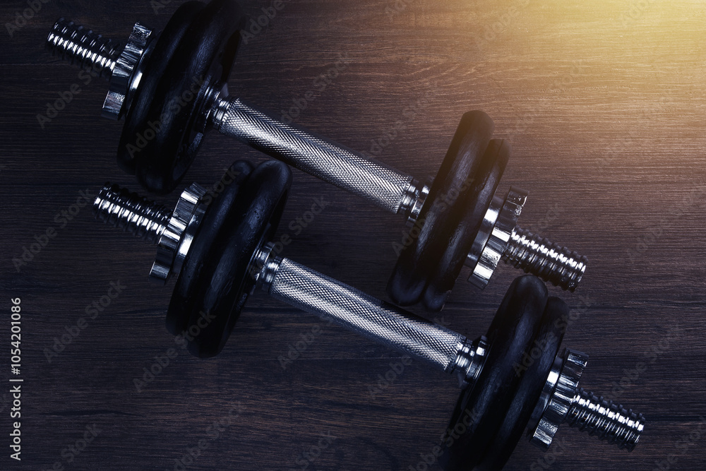Black Dumbbell Against Dark Background Black Dumbbell Against Dark Background