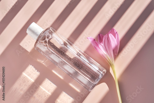 Wallpaper Mural Bottle of facial toner or cleanser on a pink background with stripes shadows. Torontodigital.ca