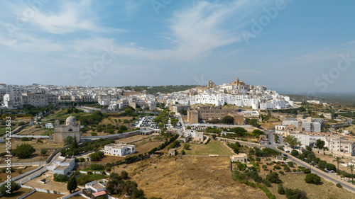 Panoramic aerial view of the city of Ostuni, also known as The White Town. It is located on a hill in the province of Brindisi, in Puglia, Italy. Surrounding the city is the Murgia countryside.