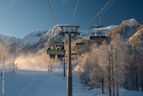 Skiers on chairlift at Rosa Khutor ski resor Winter 2020 photo