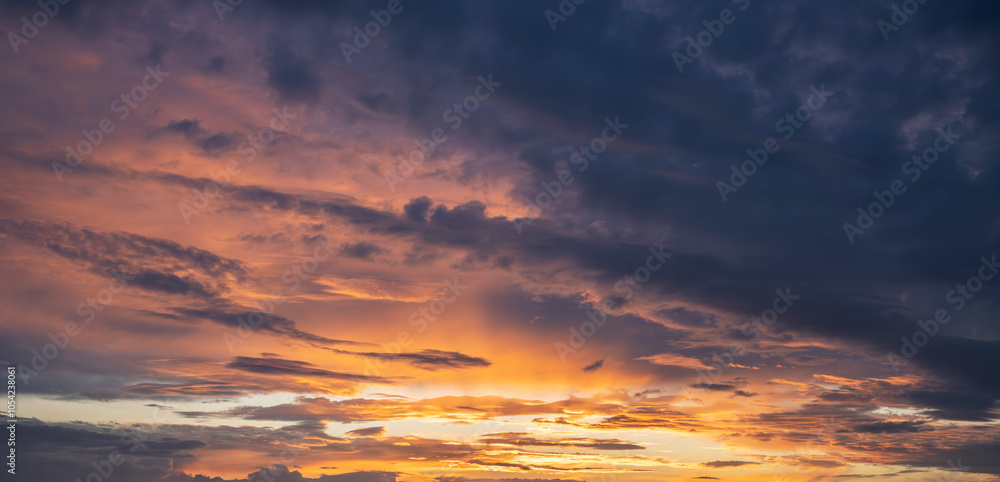 Fototapeta premium Contrasting sky with clouds at sunset.