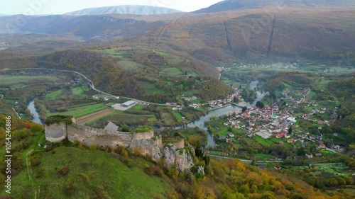 Kulen Vakuf and the ancient fortress Stari Grad Ostrovica, viewed from the air, reveal a captivating blend of history and natural beauty in Bosnia and Herzegovina. The aerial perspective captures photo