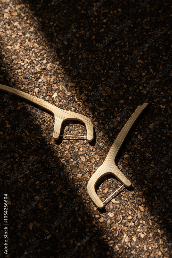 Obraz premium Close-up of Dental Floss Picks on Cork Surface
