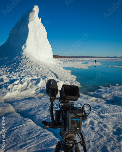 Professional Camera Capturing Arctic Iceberg Scene in Daylight