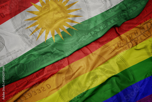 waving colorful flag of kurdistan and gay rainbow flag on the dollar money background. finance concept