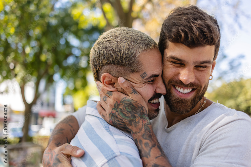 Fototapeta premium Happy gay couple embracing and smiling outdoors