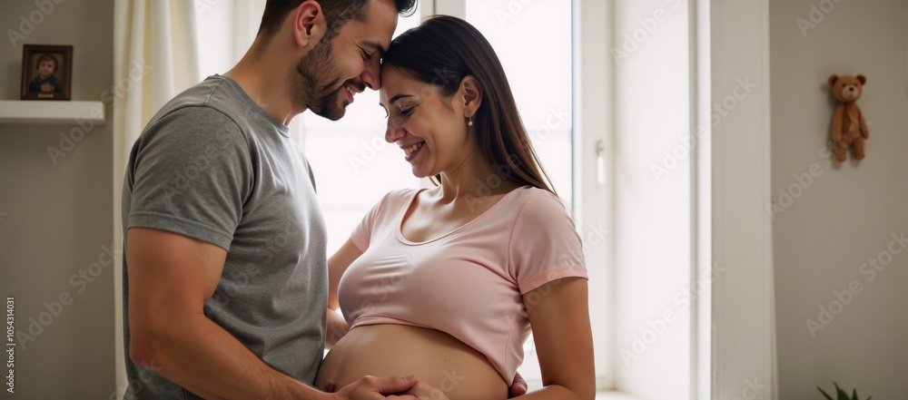 Happy couple sharing tender moments at their cozy home as the expecting mother is embraced by her loving husband Happy couple sharing tender moments at their cozy home as the expecting mother is embraced by her loving husband