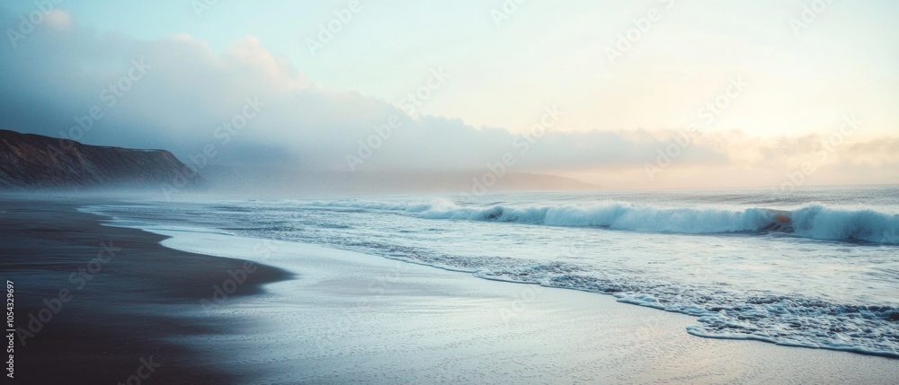 A beach with a cloudy sky and a wave in the distance A beach with a cloudy sky and a wave in the distance