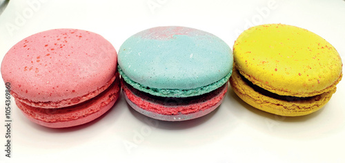 Delicious macaroon cakes isolated. Bright macarons vector background. Sweet background. Multi-colored round cookies and cakes. Bright background.