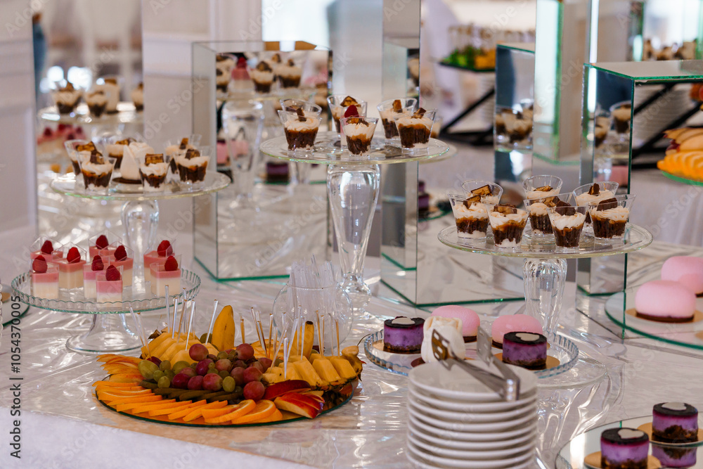 Exquisite Dessert Table Featuring an Array of Elegant Sweet Treats and Fresh Fruits Exquisite Dessert Table Featuring an Array of Elegant Sweet Treats and Fresh Fruits