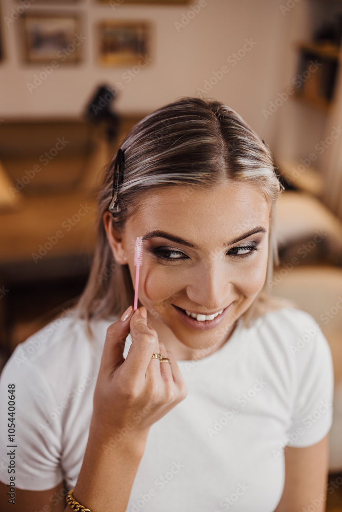 Makeup process. Professional artist applying make up on model face. Close up portrait of beautiful blonde woman in beauty salon. Makeup process. Professional artist applying make up on model face. Close up portrait of beautiful blonde woman in beauty salon.