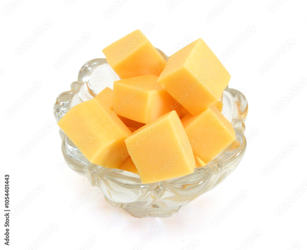 Cubes of cheddar cheese isolated on white Cubes of cheddar cheese isolated on white