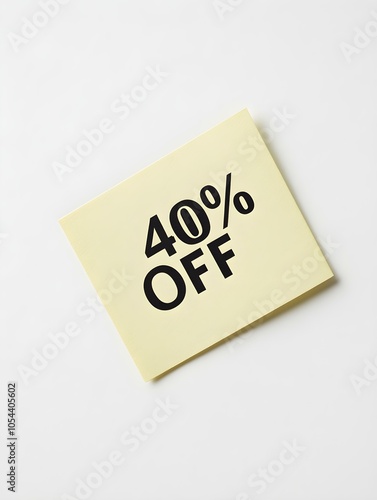 Black '40% OFF' Text on a Light Yellow Square Paper Note. White Background 