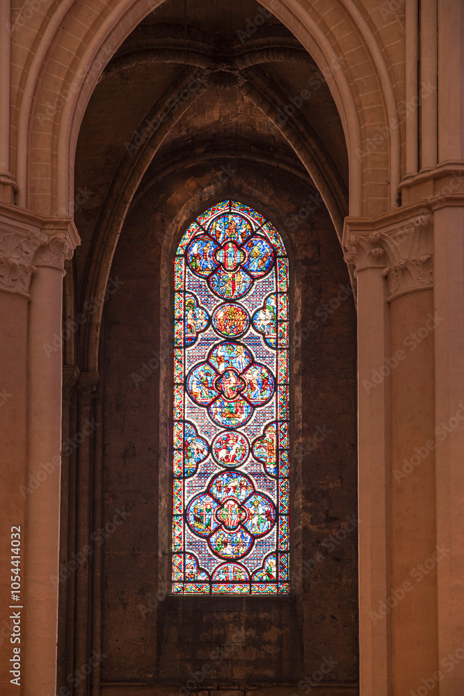 Obraz premium Detail of stained glass windows from Chartres cathedral in France, with its clock