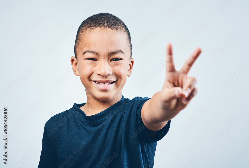 Boy, portrait and peace sign in studio, child and proud of symbol for kindness on white background. Male person, kid and emoji for support or feedback, vote and opinion of youth with icon or gesture Boy, portrait and peace sign in studio, child and proud of symbol for kindness on white background. Male person, kid and emoji for support or feedback, vote and opinion of youth with icon or gesture