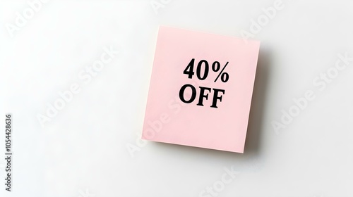 Black '40% OFF' Text on a Light Pink Square Paper Note. White Background with Copy Space