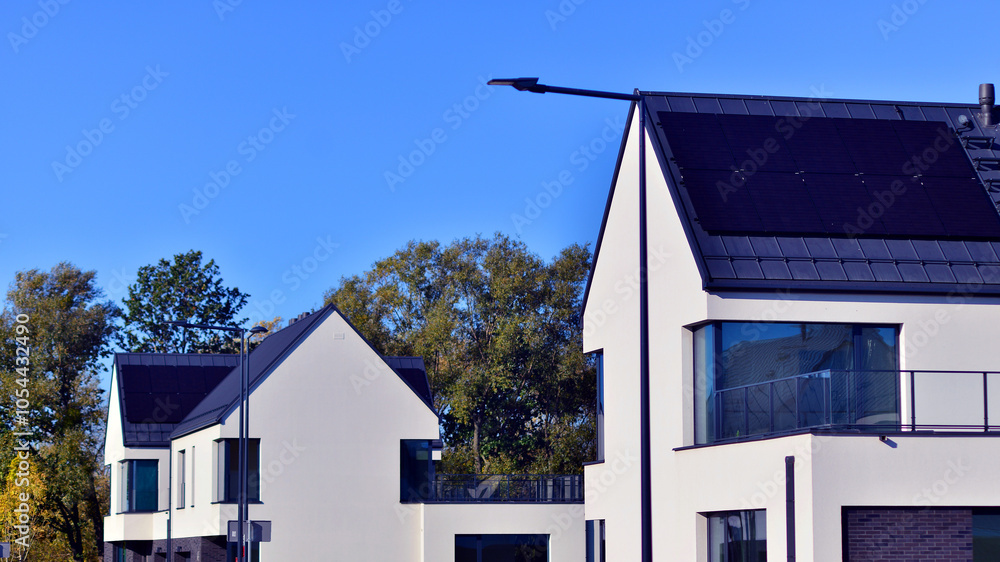 New elegant modern single family house. Terraced family homes in newly developed housing estate. Facade of a modern house with white walls. Real estate concept, european style.  
