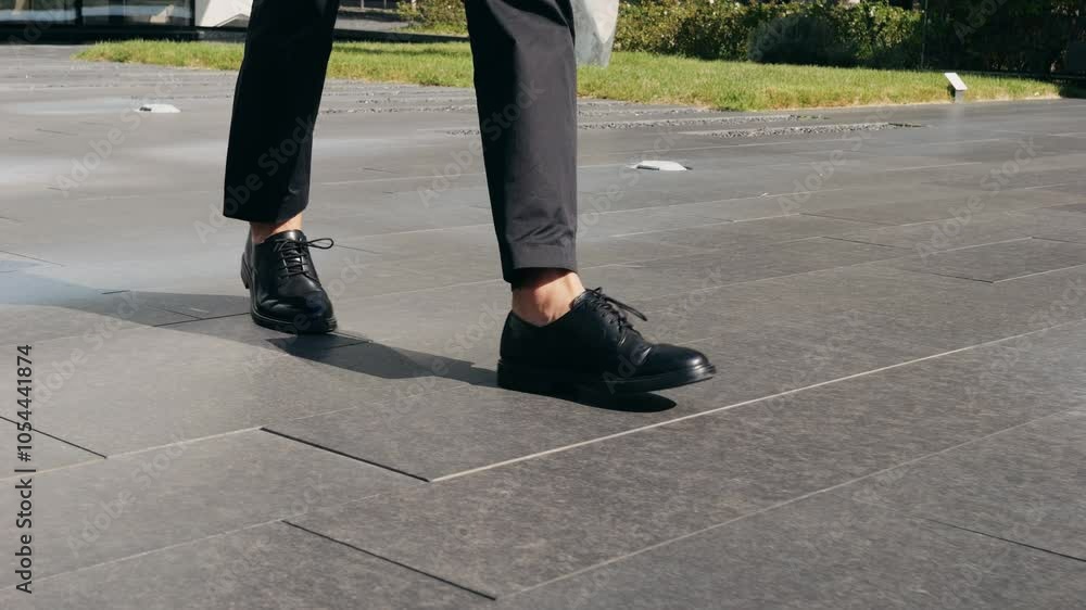 Man businessman boss walking near his office center in a dark business suit, Experienced CEO entrepreneur in modern office district Man businessman boss walking near his office center in a dark business suit, Experienced CEO entrepreneur in modern office district