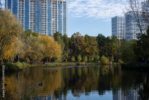 Urban development bordering a park and lake.