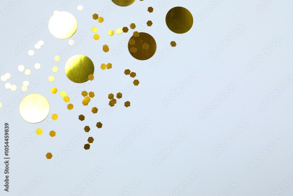 Beautiful shiny golden glitter on a white background, close-up