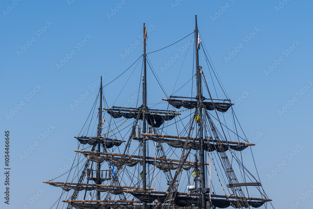 Close-Up of Pirate Ship Masts Against Clear Blue Sky – Thessaloniki Tourist Attraction, Aegean Sea Cruise Close-Up of Pirate Ship Masts Against Clear Blue Sky – Thessaloniki Tourist Attraction, Aegean Sea Cruise