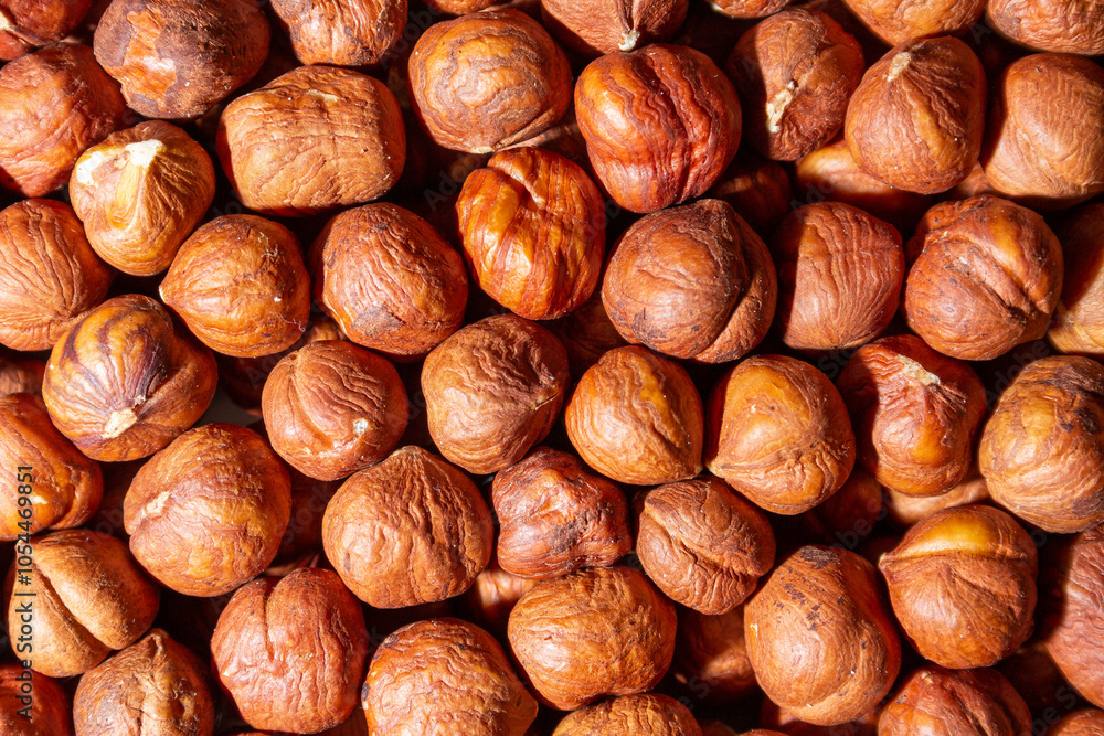 Scattered Peeled Hazelnut - Top View. Background from Hazelnuts. Natural High-Calorie Snacks Scattered Peeled Hazelnut - Top View. Background from Hazelnuts. Natural High-Calorie Snacks