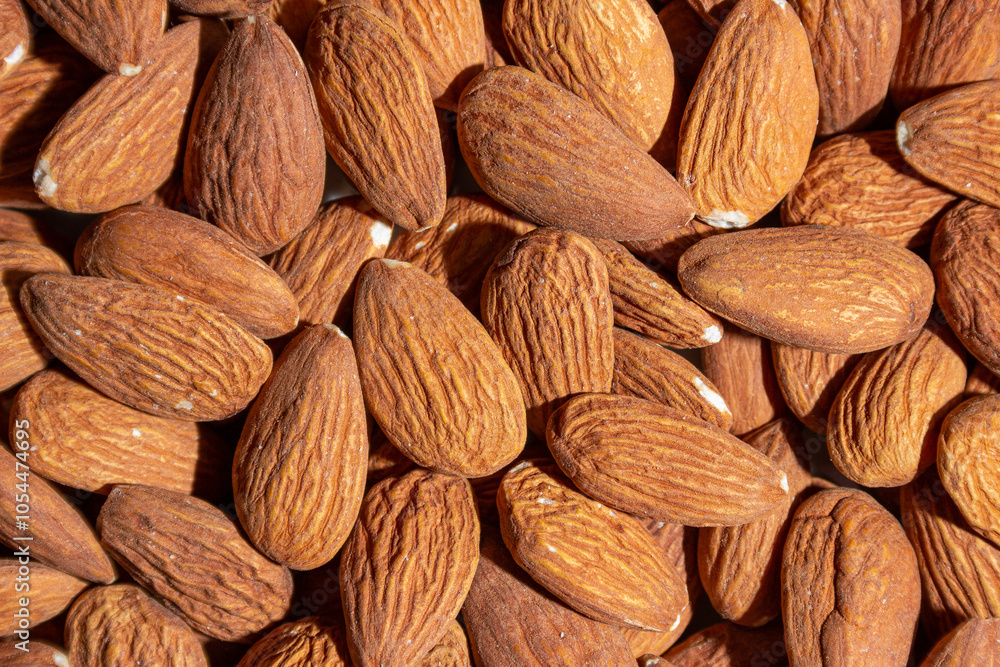 Scattered Almonds. Background from Almond Nuts. Natural High-Calorie Snacks Scattered Almonds. Background from Almond Nuts. Natural High-Calorie Snacks